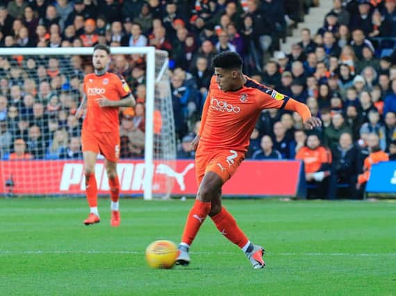 James Justin passes the ball forward against Plymouth