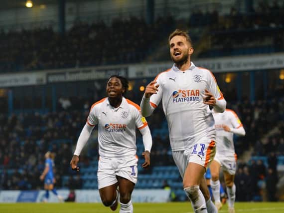 Hatters midfielder Andrew Shinnie celebrates his goal at Gillingham