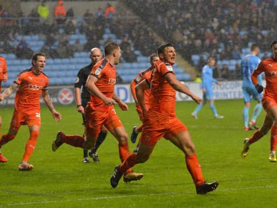 Matty Pearson celebrates scoring the opening goal at Coventry this afternoon