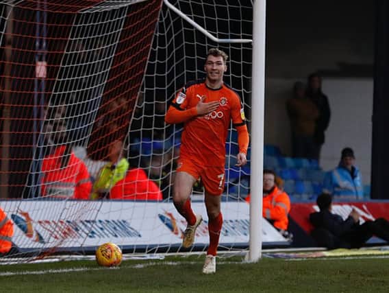 Jack Stacey celebrates putting Luton 1-0 ahead against Burton this afternoon