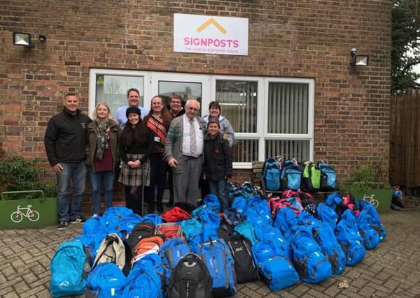 Alex and his foster parents took the bags to Signposts