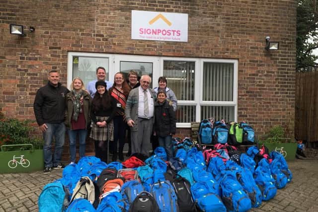 Alex and his foster parents took the bags to Signposts