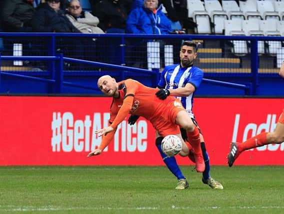 Hatters midfielder Alan McCormack is fouled at the weekend