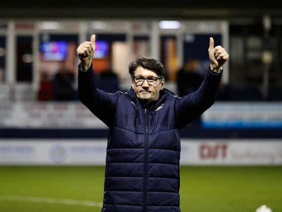 Hatters interim boss Mick Harford takes the applause on Tuesday night