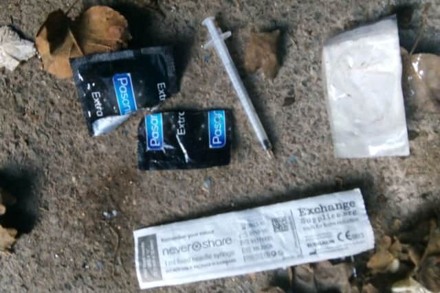 Needles and condoms found by the residents.