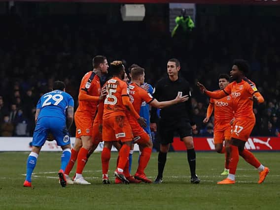 Luton players react to the challenge on Andrew Shinnie at the weekend