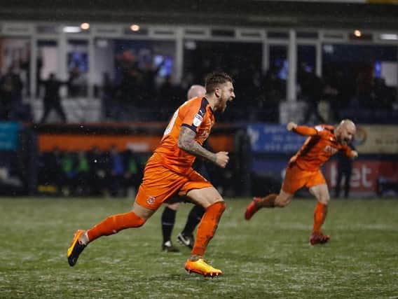 George Moncur wheels away after scoring the winner against Portsmouth