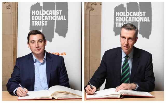 Gavin Shuker MP and Andrew Selous MP signing the Holocaust Educational Trusts Book of Commitment.