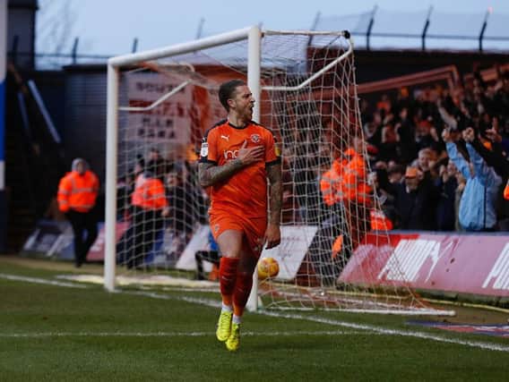 George Moncur wheels away after putting Luton 2-0 in front against Wycombe