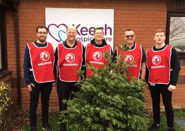 Recycling: The Vauxhall staff and the Christmas trees.
