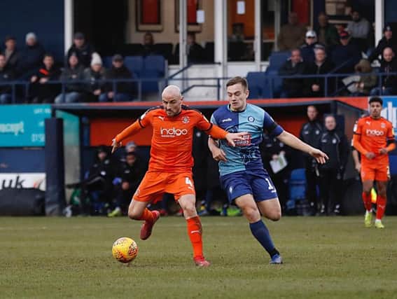 Alan McCormack holds off a challenge against Wycombe on Saturday