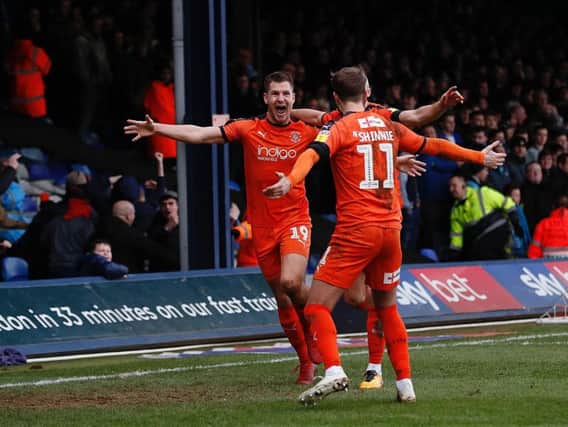 James Collins celebrates putting Luton on their way to equalling the club record of undefeated games in the Football League on Saturday