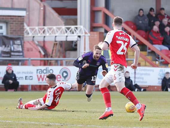 Andrew Shinnie is fouled by Fleetwood defender Jason Holt on Saturday