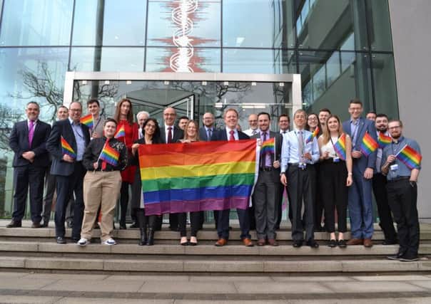The Luton Leonardo team proudly hold the rainbow flag.