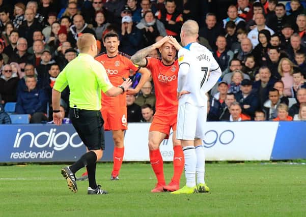Town midfielder Alan McCormack can't believe a decision has gone against him at the weekend