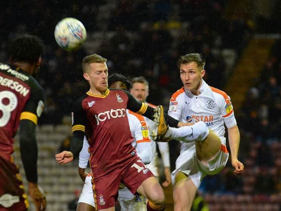 Dan Potts clears the danger at Bradford on Tuesday night