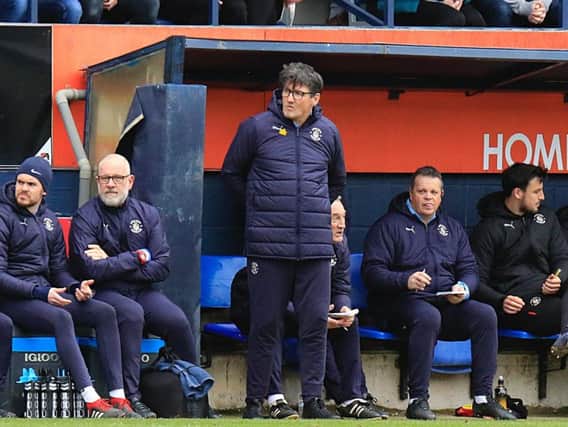 Hatters boss Mick Harford watches on against Gillingham