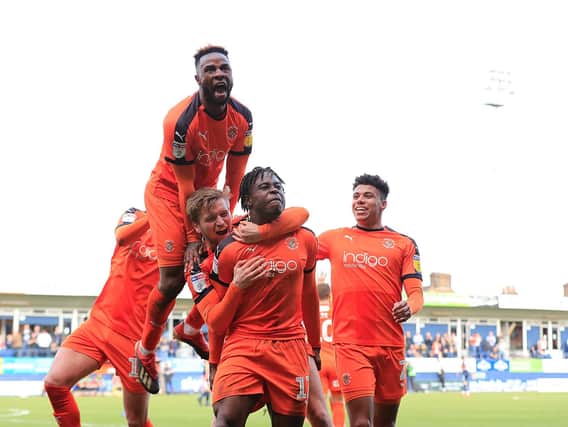 Pelly-Ruddock Mpanzu celebrates his opening goal against Doncaster