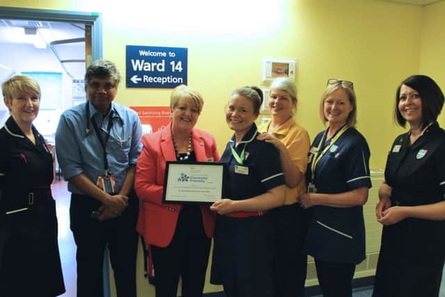 Staff from the hospital with the certificate from Luton Dementia Action Alliance