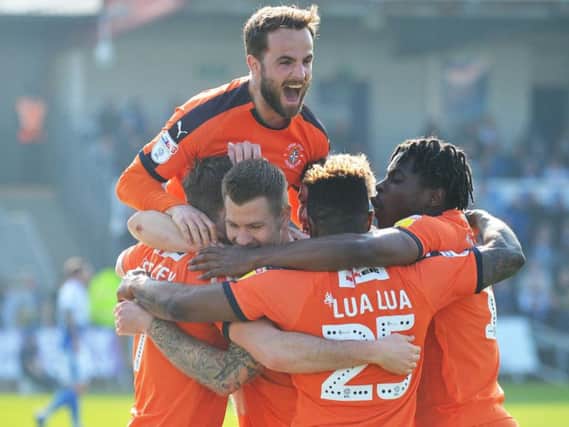 Luton celebrate James Collins' opening goal against Bristol Rovers