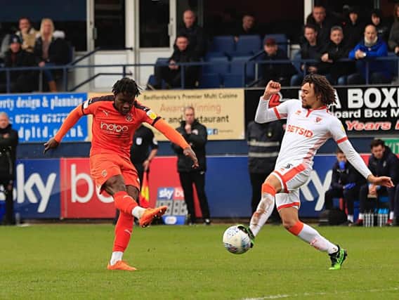 Town midfielder Pelly-Ruddock Mpanzu lets fly against Blackpool on Saturday