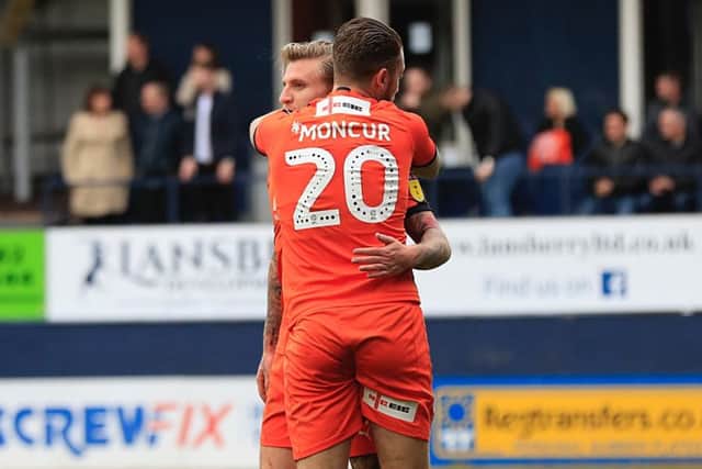 Jason Cummings gets a hug from George Moncur