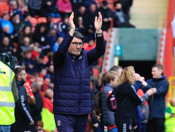 Mick Harford applauds the huge travelling support at Chartlon (Picture: Liam Smith)