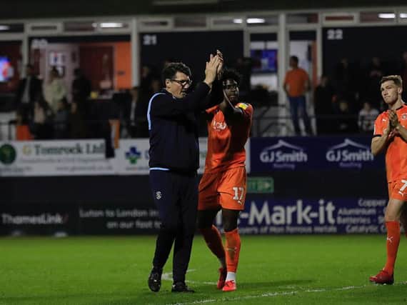 Mick Harford applauds the Town fans on Tuesday night