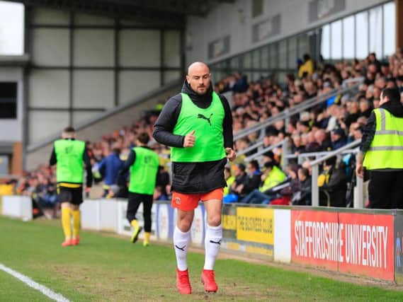 Hatters midfielder Alan McCormack was on the bench at Burton Albion