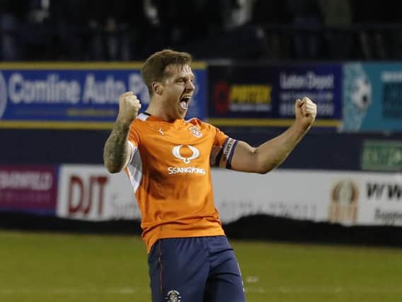 Former Luton defender Johnny Mullins has retired from professional football