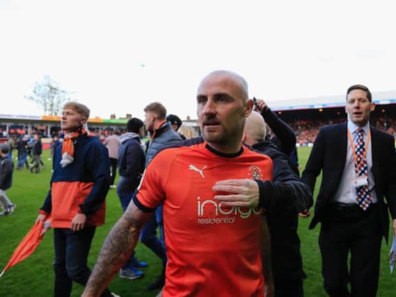 Alan McCormack leaves Kenilworth Road for the last time after the Hatters won promotion