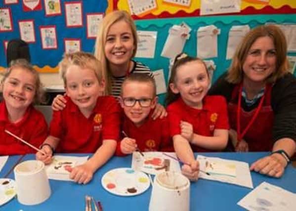 Tallulah Craft Studios member (right) with Slip End teacher Ciara Lawn (centre) and pupils