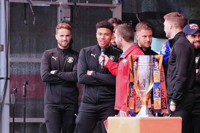 James Justin celebrates winning League One with Luton Town