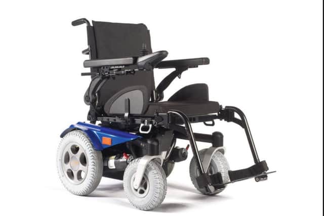 The wheelchair. (Kris's is red).
