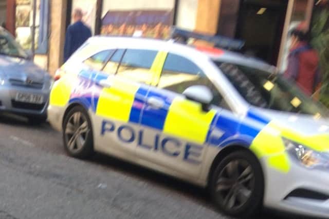 A police car at the scene in Wellington Street