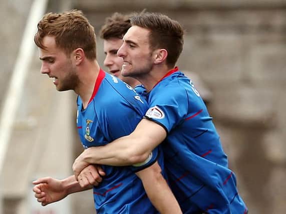 Andrew Shinnie gets a hug from brother Graeme after scoring for Inverness earlier in his career