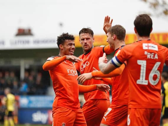 James Justin celebrates a goal during his time with Luton