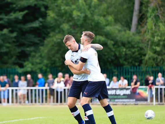 James Collins celebrates his goal with Jack Stacey on Saturday