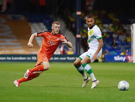 Midfielder Arthur Read in action for the Hatters