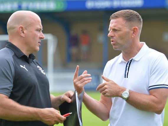 Hatters boss Graeme Jones in discussion with assistant Gary Brabin