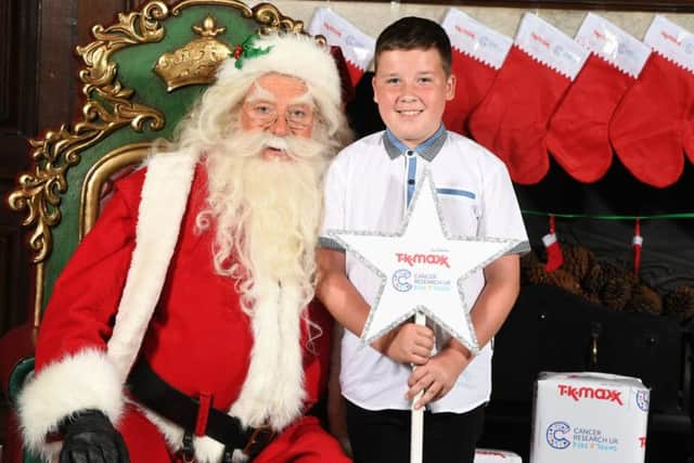 Rhys Kiernan met Santa at the Cancer Research UK Kids & Teens Star Awards party