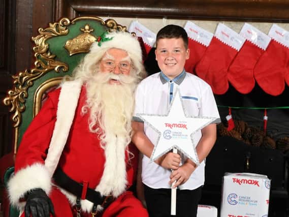 Rhys Kiernan met Santa at the Cancer Research UK Kids & Teens Star Awards party