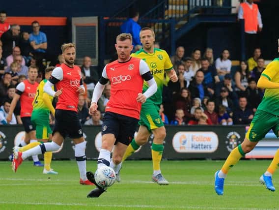 Ryan Tunnicliffe passes the ball on against Norwich