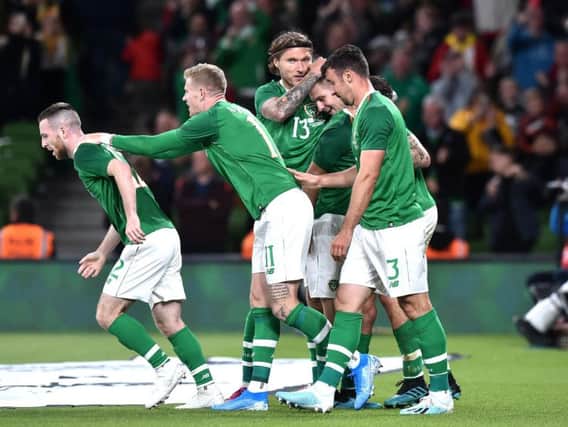 James Collins is mobbed after scoring his first goal for Ireland last night