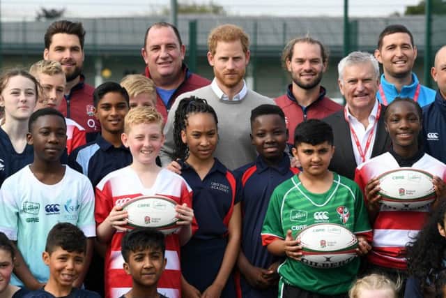 The Duke posed with young rugby players