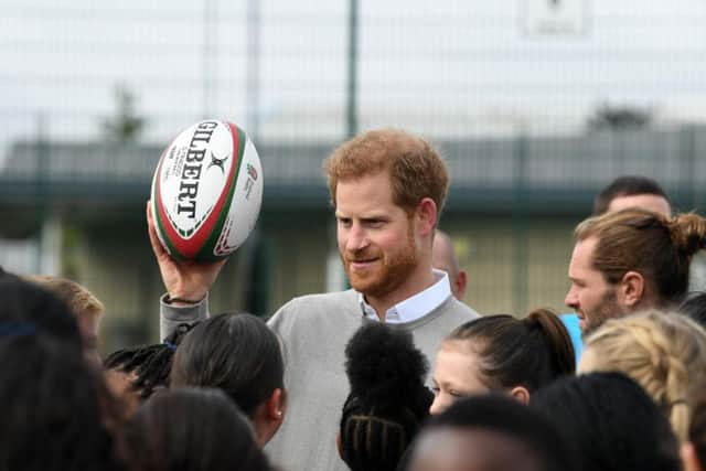 The Duke threw a rugby ball for pupils