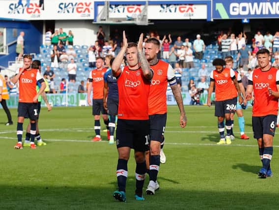 James Collins applauds the visiting faithful on Saturday