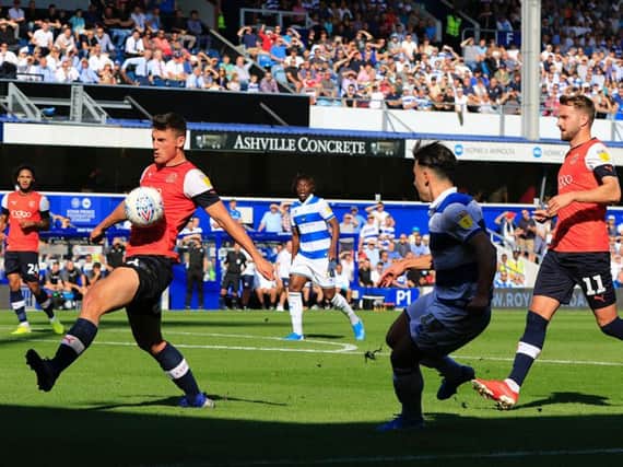 Matty Pearson makes a block as Town came under intense pressure at QPR on Saturday