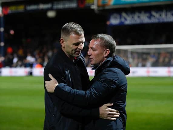 Graeme Jones greets Leicester boss Brendan Rodgers this evening