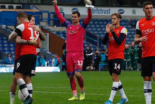Simon Sluga celebrates Town's 2-1 win at Blackburn